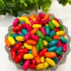 WOODEN0038- 25GM PACK OF 15MM X 7MM OVAL SHAPE MULTICOLOR WOODEN BEADS FOR BRACELETE | RAKHI MAKING (APPROX 85PCS))